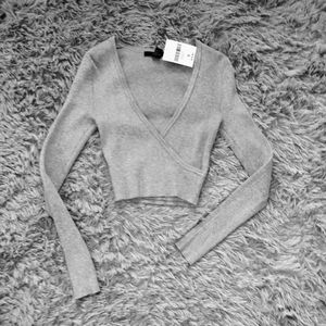 Cropped faux wrapped sweater